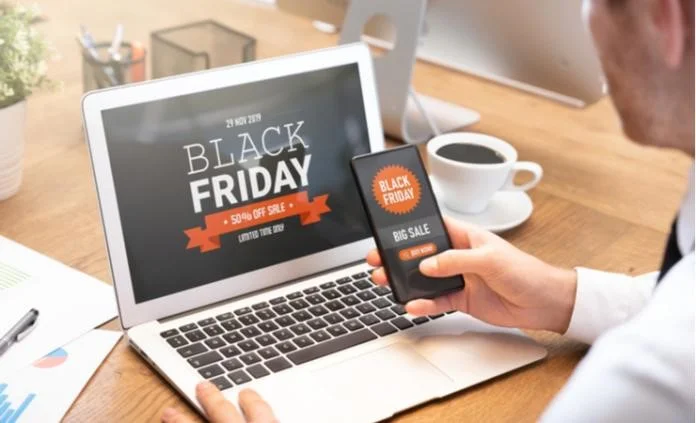 person using a computer shopping for black friday deals
