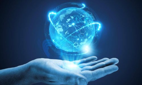 International-Business person holding a holographic globe